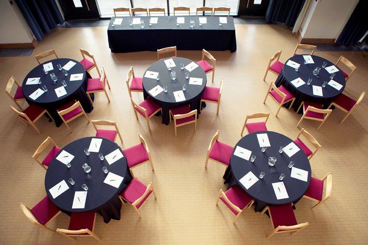 The Guildhall with tables laid and curtains drawn