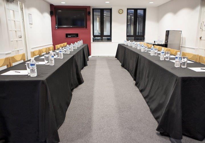 Conference room with projector screen and seating